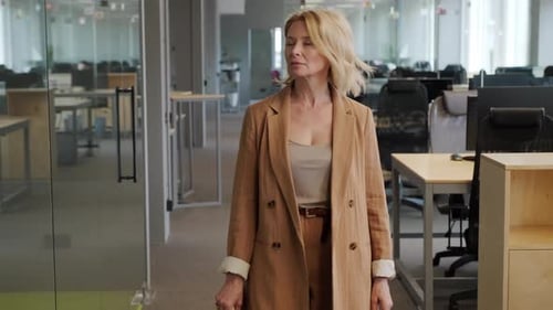 Business Woman Walking Along Office