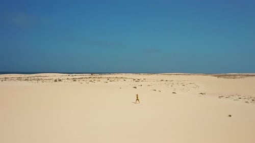 Aerial Flight Over White Sand Dunes in the Desert