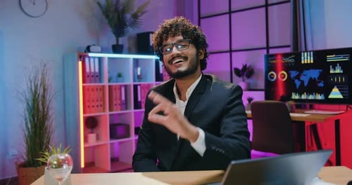 Businessman in Glasses Posing on Camera in Evening Office with ok Hands Symbol