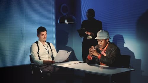 Intense Interrogation Scene in a Dark Room