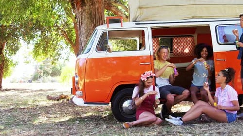 Friends Making Bubbles During Road Trip
