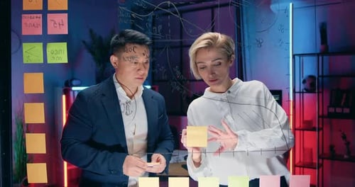 Corporate Team Brainstorming Plans in Modern Office