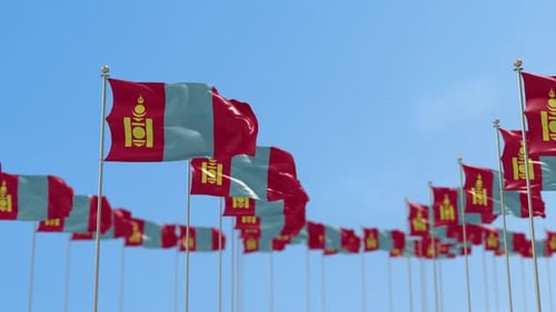 Mongolian Flags Waving on Flagpoles Against Blue Sky