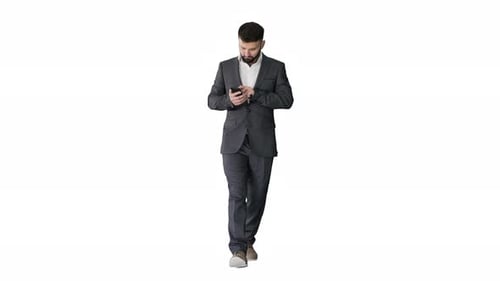 Man in Suit Walks with Smartphone