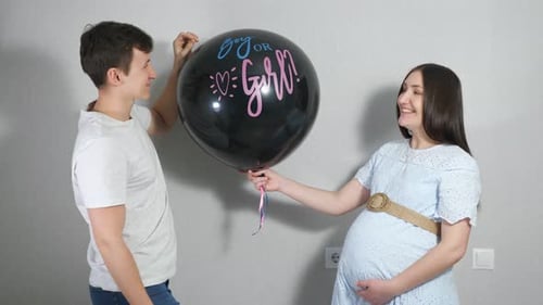 Young Couple Reveal Baby Gender With Confetti Balloon