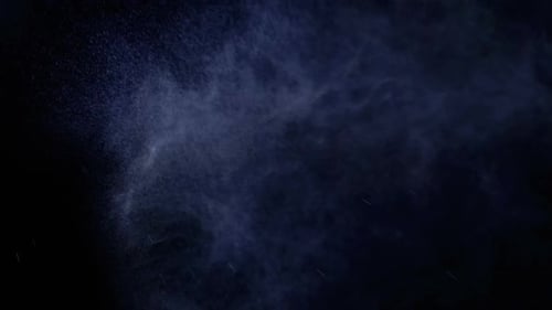 Aerosol Sprays Small Drops of Water on a Black Background. Slow Motion