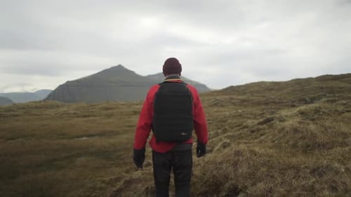Hiker Walking In Klakkur Landscape