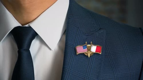 Business Person Wearing Lapel Pin of Two Nations' Flags