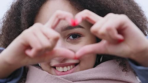Woman Making Heart With Hands Close Up