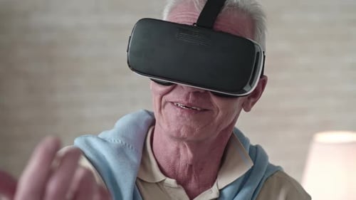 Senior Man Enjoys Virtual Reality Headset Experience
