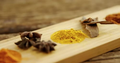 Culinary Spices Arranged Artfully on a Wooden Board