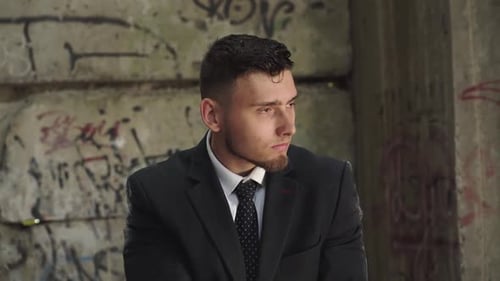 Man in Suit Tries to Shoot with Pistol in Abandoned Building