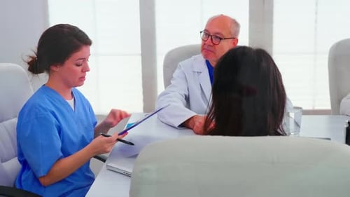 Medical Professionals Collaborating on Patient Care in Meeting
