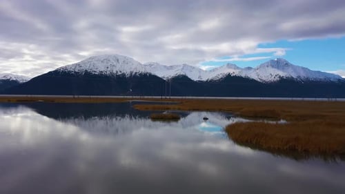 Snowy Mountains and Golden Fields Aerial View