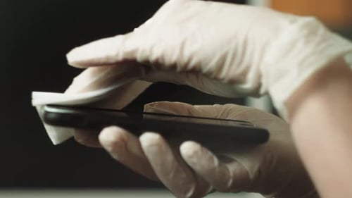 Hands in Gloves Clean Smartphone Screen