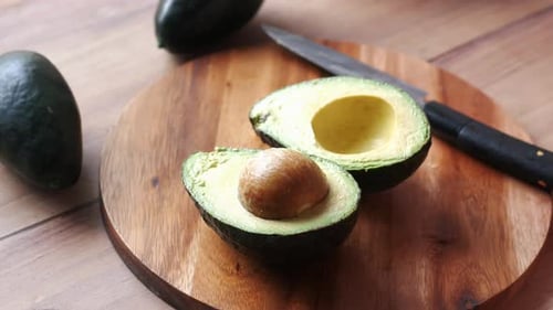 Fresh Avocado on Wooden Cutting Board