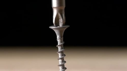Man Using a Drill and Screwdriver on Wooden Plate, Black, Slow Motion, Close Up, Upwards