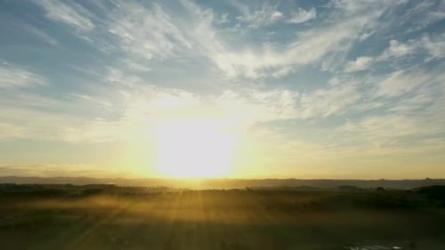 Sunrise Aerial View of Misty Rural Landscape