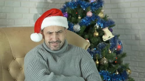 Depressed Man Mood By Christmas Tree