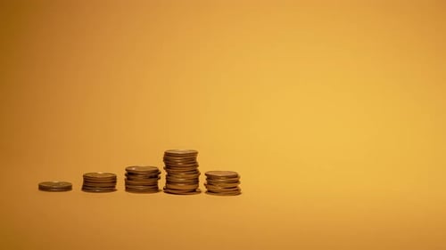 Increasing Coin Stacks Representing Financial Growth
