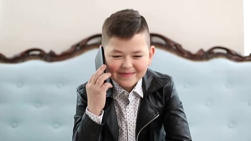 Happy Boy Talking on Cell Phone Smiling