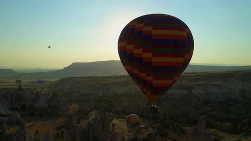 Hot Air Balloons Floating Over a Desert Landscape