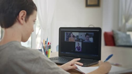 Boy Attends Online Class, Takes Notes