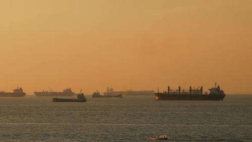 Boat In The Sea At Sunset
