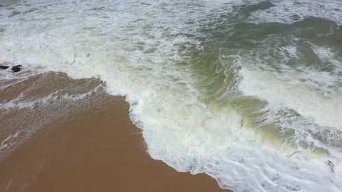 flying over the waves and the beach