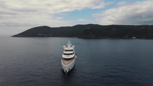 Private luxury yacht and small jet boat, front aerial view. Private huge super yacht.