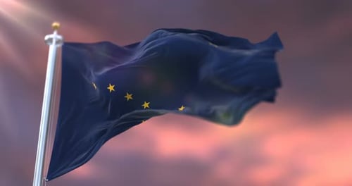 Alaska State Flag Waving Loop Against Dramatic Sky