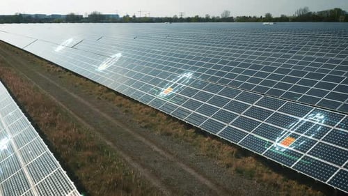Fly Over Rows of Photovoltaic Panels on Solar Farm