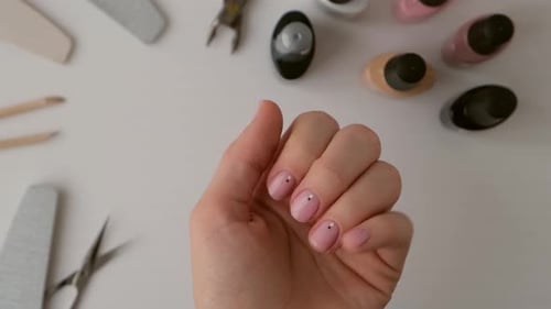 Elegant Woman's Manicured Hand with Polished Nails