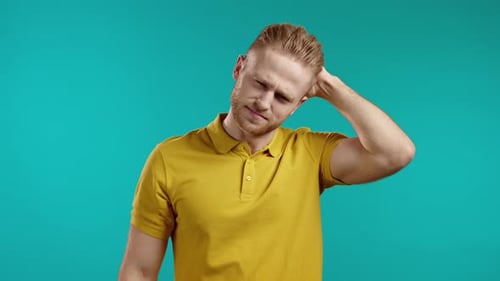 Young Man Having Headache Studio Portrait