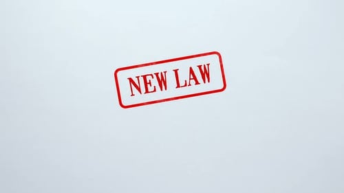 Macro Shot of New Law Stamp on White