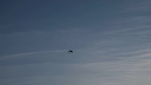 Small Airplane Flying in Blue Sky