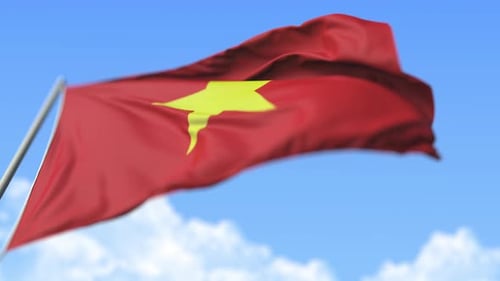 Realistic Waving Vietnam Flag Against Blue Sky Background