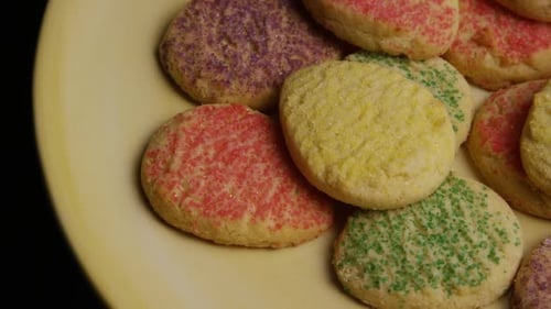 Delicious Sugar Cookies with Multicolored Sprinkles on Plate