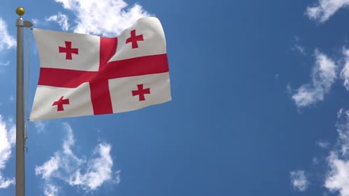 Waving Flag of Georgia Against a Clear Blue Sky