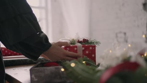 Christmas Present Being Placed on Table