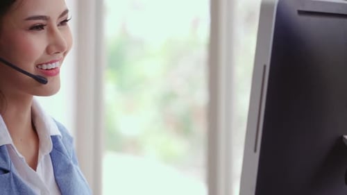 Customer Support Agent or Call Center with Headset Talking to Customer on Phone