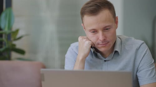 Beautiful Male Developer or Student Working Studying By Laptop in Cafe