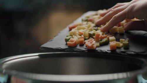 Alphabet Pasta Being Added to Cooking Pot