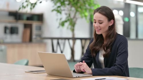 Woman on a Video Conference Call at Work