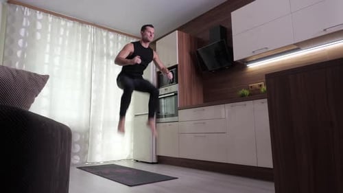 Man Exercising at Home on Yoga Mat
