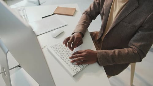 Unrecognizable Man Working In Office