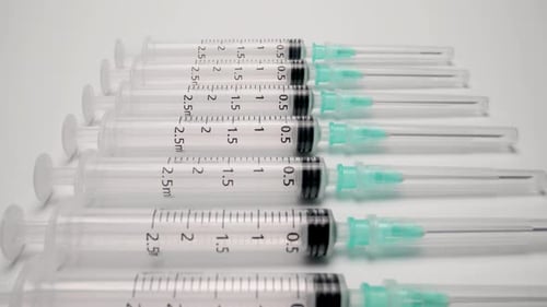 A Row of Medical Syringes