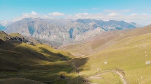 beautiful valley landscape with a bird's eye view on the background of mountains. road in a mountain