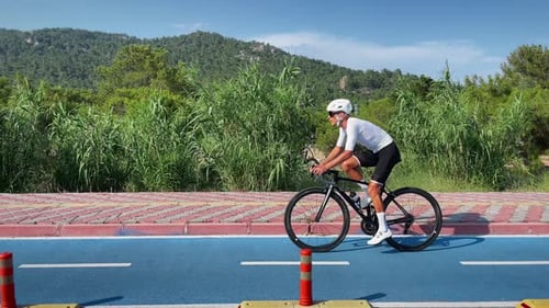Cyclist riding bicycle on bicycle lane