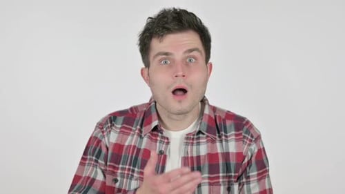 Man Reacts in Surprise with Hand Over Mouth